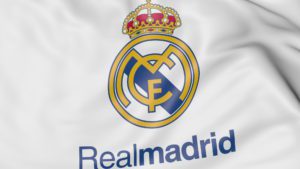 Close-up of waving flag with Real Madrid C.F. football club logo
